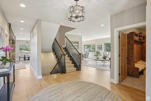 2570 Aspen Springs Dr, Park City, UT 84060 - entrance foyer with a chandelier, healthy amount of natural light, light wood-style floors, recessed lighting, and stairway