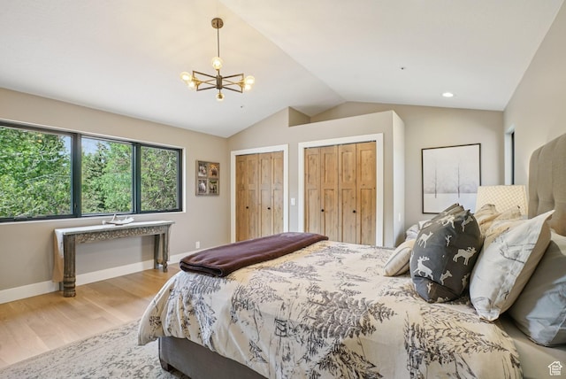 2570 Aspen Springs Dr, Park City, UT 84060 - bedroom with multiple closets, a chandelier, lofted ceiling, and wood finished floors