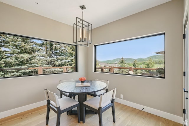 2570 Aspen Springs Dr, Park City, UT 84060 - dining room featuring a chandelier, wood finished floors, and a mountain view
