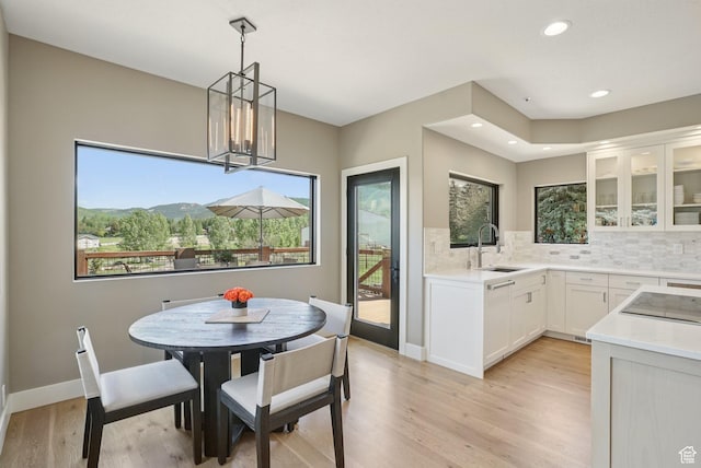 2570 Aspen Springs Dr, Park City, UT 84060 - dining room featuring light wood-type flooring, recessed lighting, and a chandelier