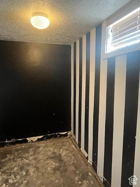 210 W 100 S, Centerfield, UT 84622 - below grade area featuring wallpapered walls and a textured ceiling