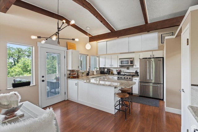 4560 S Wallace Ln, Holladay, UT 84117 - kitchen featuring high end appliances, a peninsula, decorative backsplash, white cabinetry, and beam ceiling