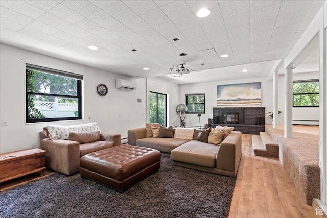 4560 S Wallace Ln, Holladay, UT 84117 - living room featuring a wall mounted air conditioner, wood finished floors, baseboard heating, healthy amount of natural light, and recessed lighting