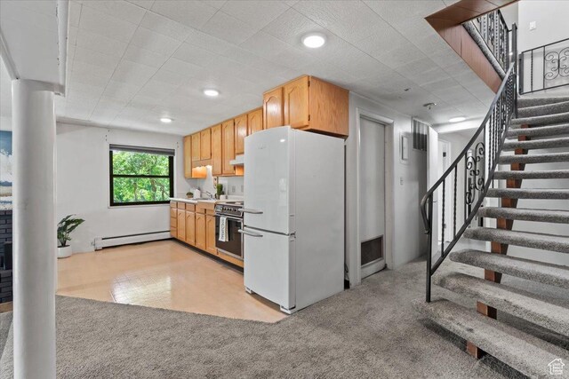4560 S Wallace Ln, Holladay, UT 84117 - kitchen featuring freestanding refrigerator, stainless steel stove, light carpet, baseboard heating, and light countertops