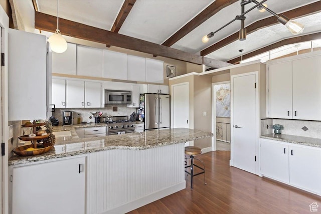 4560 S Wallace Ln, Holladay, UT 84117 - kitchen featuring high quality appliances, a peninsula, decorative backsplash, dark wood-style flooring, and hanging light fixtures