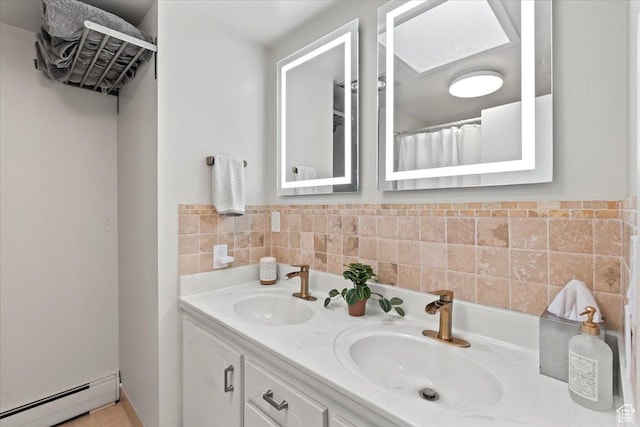 4560 S Wallace Ln, Holladay, UT 84117 - full bathroom featuring a baseboard heating unit and double vanity