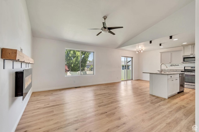 327 E 2260 S, Heber City, UT 84032 - unfurnished living room with ceiling fan, light wood-type flooring, and high vaulted ceiling