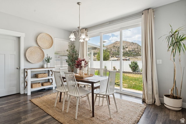 13698 S Black Hoof Cir, Herriman, UT 84096 - dining area featuring a mountain view, a chandelier, and wood finished floors