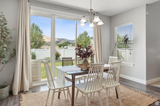 13698 S Black Hoof Cir, Herriman, UT 84096 - dining room featuring a chandelier and wood finished floors