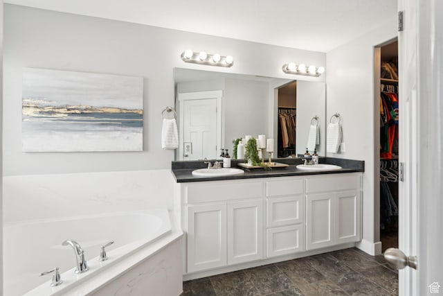13698 S Black Hoof Cir, Herriman, UT 84096 - bathroom with double vanity, a garden tub, and a walk in closet