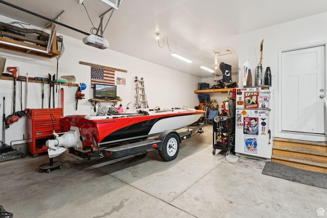 13698 S Black Hoof Cir, Herriman, UT 84096 - garage featuring a workshop area and a garage door opener