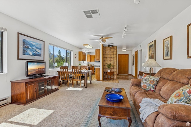 34 Valley View Dr, Springdale, UT 84767 - living area featuring light colored carpet, ceiling fan, and rail lighting
