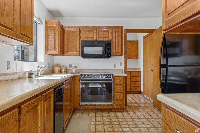 34 Valley View Dr, Springdale, UT 84767 - kitchen with black appliances, light countertops, and brown cabinets