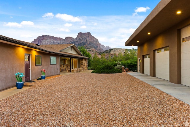 34 Valley View Dr, Springdale, UT 84767 - view of home's exterior with a mountain view and a garage