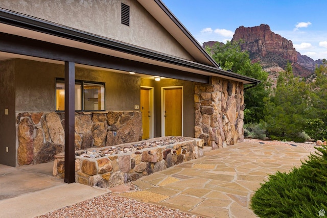 34 Valley View Dr, Springdale, UT 84767 - doorway to property with stone siding, stucco siding, and a mountain view