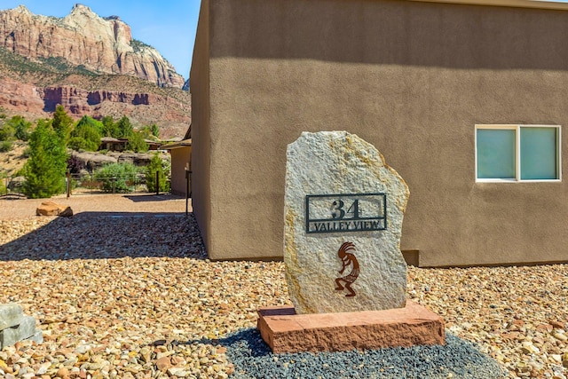 34 Valley View Dr, Springdale, UT 84767 - exterior view of stucco siding and a mountain backdrop