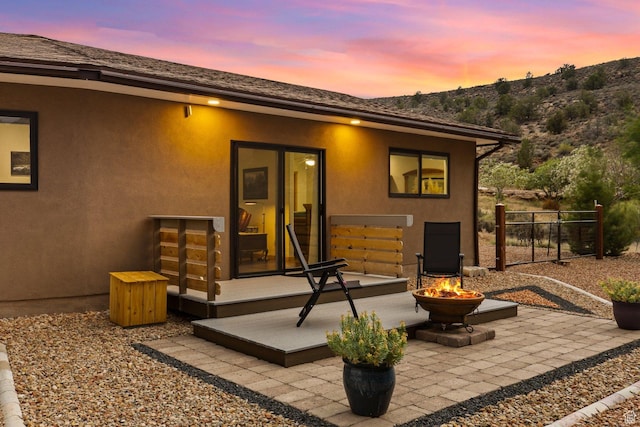 34 Valley View Dr, Springdale, UT 84767 - rear view of property with a fire pit, a patio area, stucco siding, and a mountain view