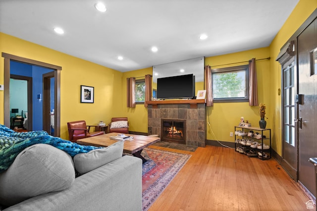 832 E Ramona Ave, Salt Lake City, UT 84105 - living room featuring a tiled fireplace, hardwood / wood-style floors, and recessed lighting