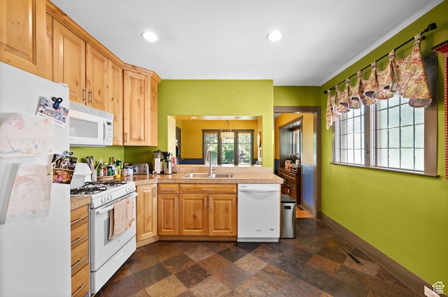 832 E Ramona Ave, Salt Lake City, UT 84105 - kitchen with white appliances, tile counters, dark stone finish floors, a peninsula, and recessed lighting