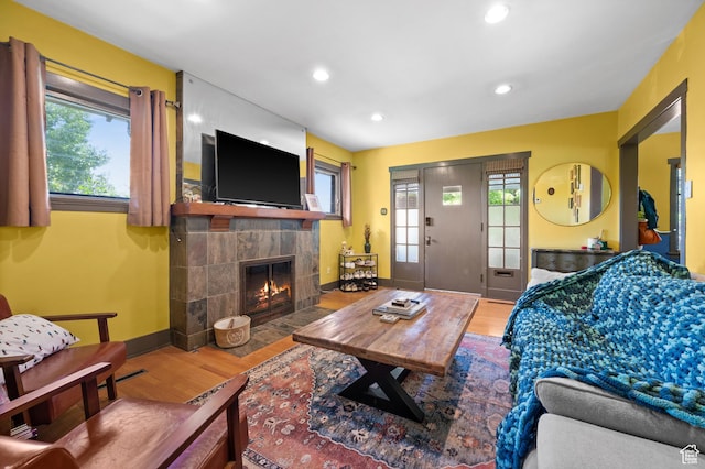 832 E Ramona Ave, Salt Lake City, UT 84105 - living area with wood finished floors, plenty of natural light, a tile fireplace, and recessed lighting