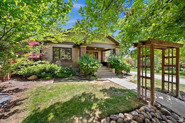 832 E Ramona Ave, Salt Lake City, UT 84105 - view of front of home featuring brick siding, a porch, and a front lawn