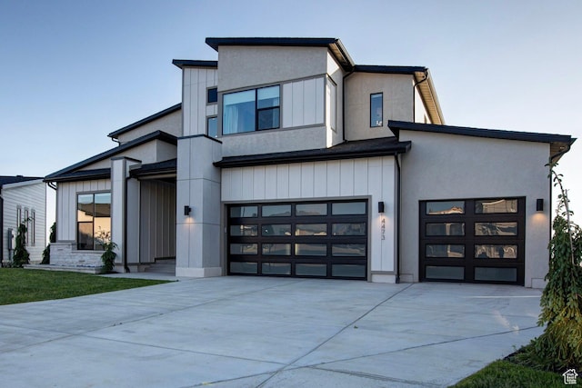 4473 N Solstice Dr, Lehi, UT 84043 - contemporary house featuring concrete driveway, a garage, and stucco siding