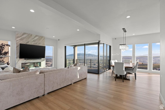 4473 N Solstice Dr, Lehi, UT 84043 - living room featuring light wood-style flooring, recessed lighting, and a chandelier