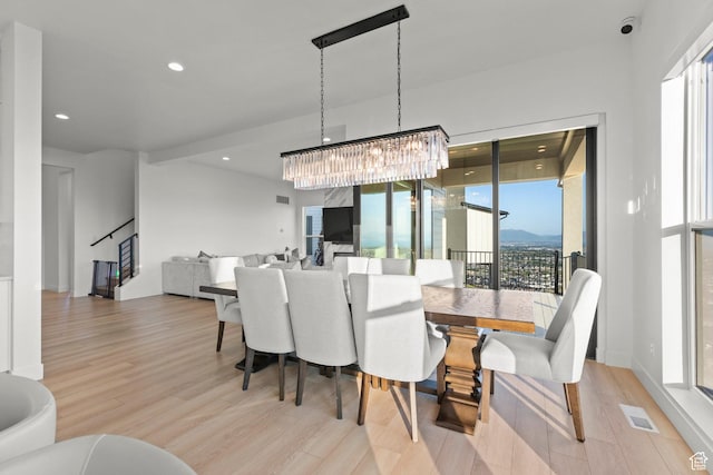 4473 N Solstice Dr, Lehi, UT 84043 - dining area with light wood-style flooring, a chandelier, stairs, and recessed lighting