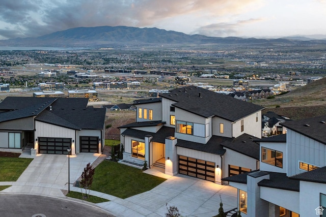 4473 N Solstice Dr, Lehi, UT 84043 - view of front facade with driveway, a mountain view, and an attached garage