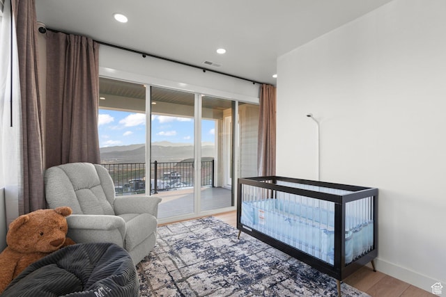 4473 N Solstice Dr, Lehi, UT 84043 - bedroom with access to outside, light wood-style flooring, a mountain view, and recessed lighting