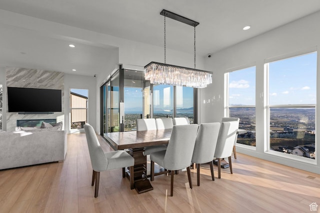 4473 N Solstice Dr, Lehi, UT 84043 - dining space featuring a chandelier, light wood-style flooring, and recessed lighting