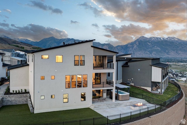 4473 N Solstice Dr, Lehi, UT 84043 - back of house with a balcony, a patio area, a mountain view, and a fenced backyard