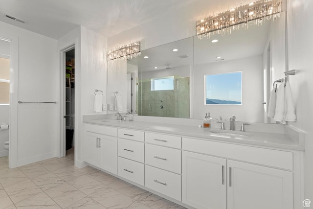 4473 N Solstice Dr, Lehi, UT 84043 - bathroom featuring a shower stall, double vanity, marble finish flooring, a spacious closet, and recessed lighting