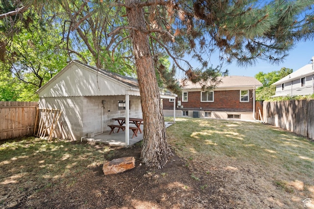454 E Bryan Ave, Salt Lake City, UT 84115 - fenced backyard with a patio area
