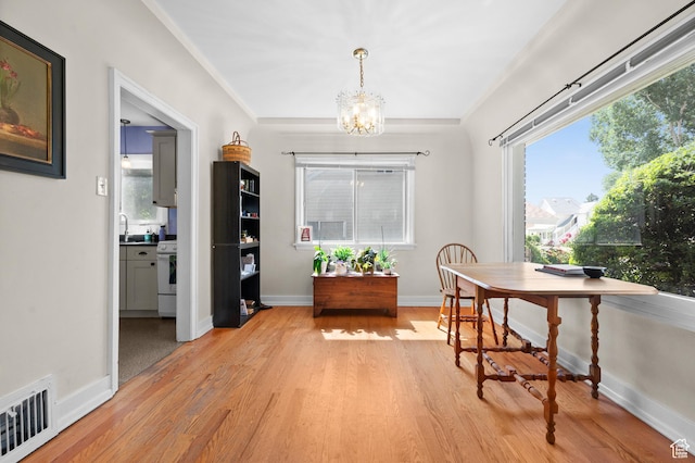 454 E Bryan Ave, Salt Lake City, UT 84115 - office area with a chandelier and light wood finished floors