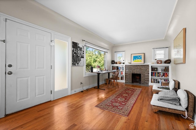 454 E Bryan Ave, Salt Lake City, UT 84115 - living area with wood finished floors and a brick fireplace