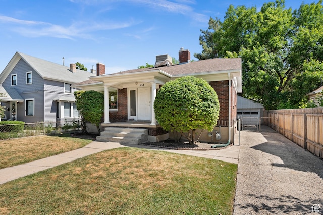 454 E Bryan Ave, Salt Lake City, UT 84115 - view of front facade featuring brick siding, a chimney, an outbuilding, and covered porch