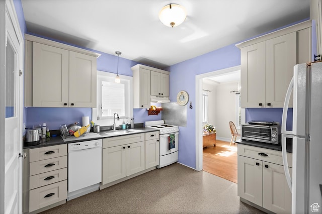 454 E Bryan Ave, Salt Lake City, UT 84115 - kitchen with white appliances, under cabinet range hood, dark countertops, and decorative light fixtures