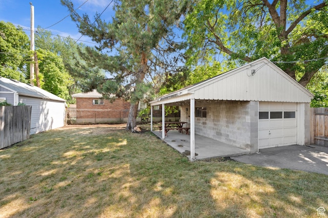 454 E Bryan Ave, Salt Lake City, UT 84115 - fenced yard with a garage