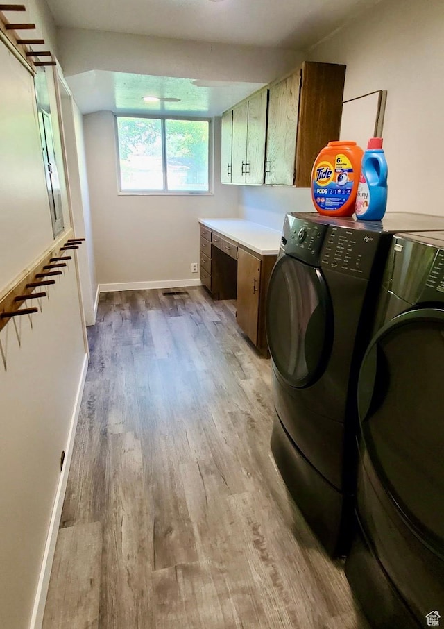 1775 S 290 E, Orem, UT 84058 - laundry area featuring cabinet space, washer and clothes dryer, light wood-type flooring, and an office area