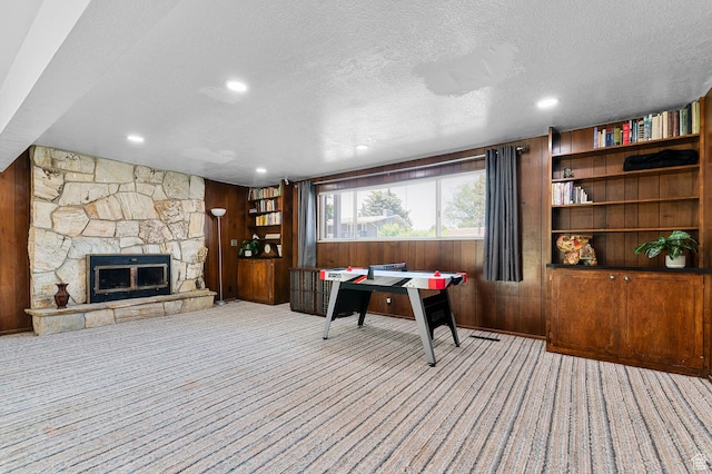 1775 S 290 E, Orem, UT 84058 - office space featuring wood walls, carpet flooring, a textured ceiling, a fireplace, and recessed lighting