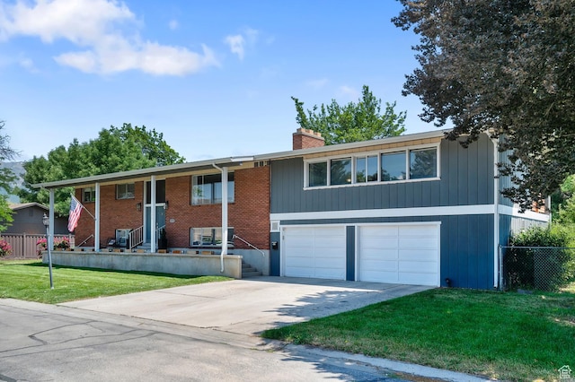 1775 S 290 E, Orem, UT 84058 - split foyer home with a garage, concrete driveway, a chimney, and covered porch