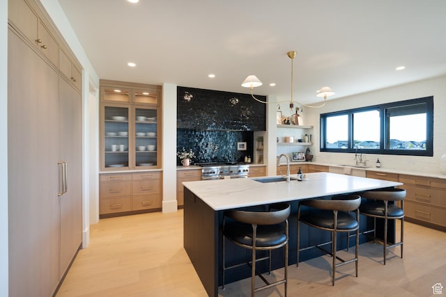 1889 W 1400 S, Lehi, UT 84043 - kitchen featuring decorative backsplash, recessed lighting, an island with sink, stainless steel gas stove, and a breakfast bar