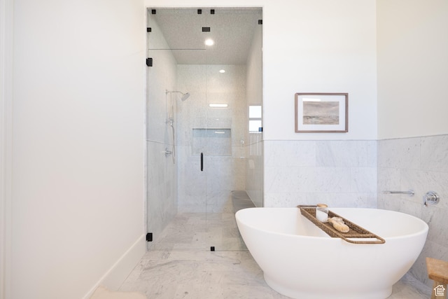 1889 W 1400 S, Lehi, UT 84043 - full bathroom with a stall shower, a freestanding tub, tile walls, marble finish flooring, and a wainscoted wall