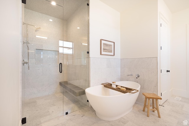 1889 W 1400 S, Lehi, UT 84043 - bathroom with a stall shower, a freestanding bath, marble finish flooring, a wainscoted wall, and recessed lighting