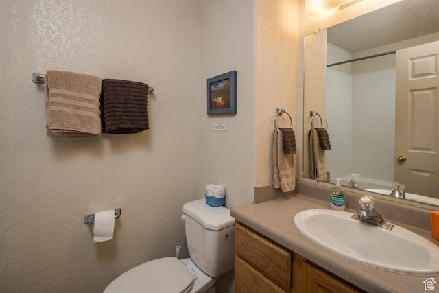 3287 E Fairway Loop, Moab, UT 84532 - bathroom with vanity, a shower, and a textured wall