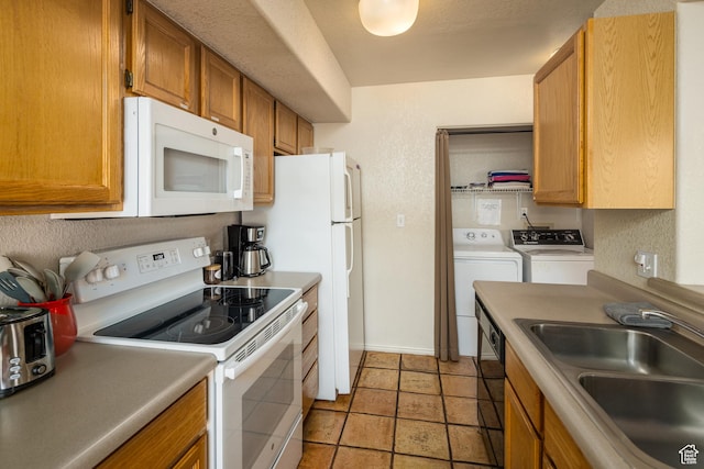 3287 E Fairway Loop, Moab, UT 84532 - kitchen featuring white appliances, washer and dryer, brown cabinets, light countertops, and light tile patterned flooring
