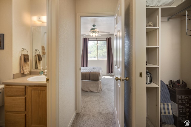 3287 E Fairway Loop, Moab, UT 84532 - bathroom featuring vanity, a ceiling fan, and a textured wall