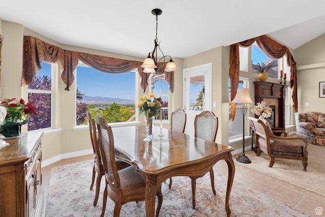 328 S 1060 E, Santaquin, UT 84655 - dining space with light tile patterned floors, a chandelier, and a fireplace