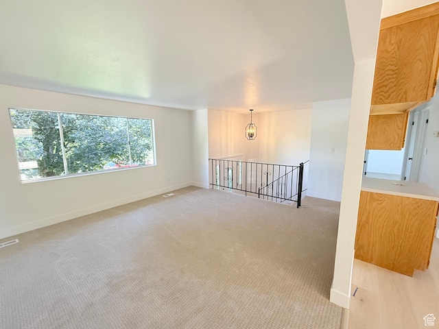 3841 W Bluebird Cir, West Valley City, UT 84120 - spare room with light carpet and baseboards